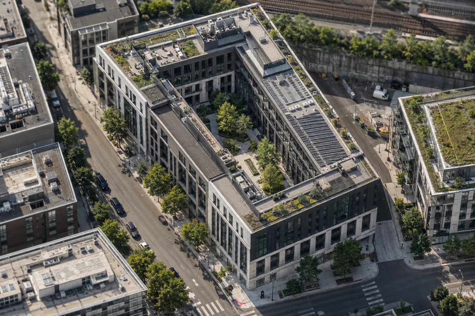 A mixed-use building organized around a landscaped urban courtyard